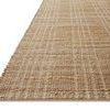 Low angle side view showing the flat woven texture and edges of the Judy Natural cream rug