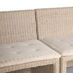 Detailed view of corner backrests showing rattan weave and padded cushions edge