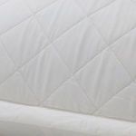 Close-up of quilted diamond stitching and smooth bamboo sateen texture on Monaco coverlet