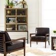 Angle showing clear glass-front doors on Spencer Curio Cabinet with varied decorative items