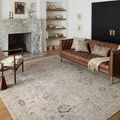 Living room styled with the Monroe Natural Multi Rug placed under furniture, illustrating room scale and décor coordination