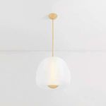 Scranton Pendant illuminated in minimalist empty room highlighting its glowing opal glass core