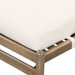 Close-up showing cushion corner with tight, smooth fabric on wooden frame
