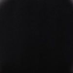 Extreme close-up of black polyfoam seat texture revealing subtle matte finish