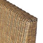 Close-up of backrest corner featuring rounded woven rattan detail