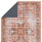 Rug flipped corner showing navy solid backing with tight weave