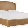 Driftwood California King bed with caramel leather upholstery, simple wood feet, and curved headboard design