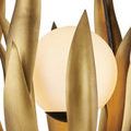 Evenly spaced brass leaves focus with aged steel frame partially visible from side
