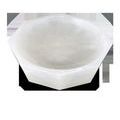 Angled top-down view highlighting the bowl’s translucent alabaster surface and carved facets