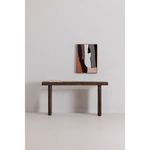 Monterey console table in minimalist room setting with abstract wall art and stacked books
