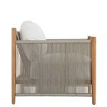 Side profile showing deep seat cushion with beige rope and teak armrest