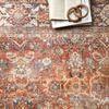 Close-up showing detailed worn floral medallion patterns and textured power-loomed polyester fibers