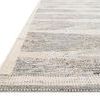 Close-up side angle showing the texture and tight weave of Evelina Pewter Silver Rug's fibers and edge