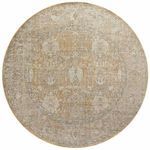 Round version of rug with same muted gold and sand medallion pattern and textured border