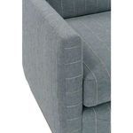 Close-up of armrest’s fabric and seam with subtle stripe pattern contrast
