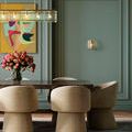 Duvernell Wall Sconce shown mounted on a wall in an elegant dining room setting