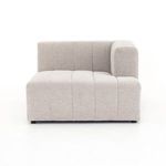 Low angle view of sofa corner with vertical channel lines and smooth fabric finish