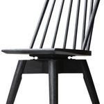 Swivel mechanism visible beneath the seat connecting chair to base