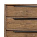 Close-up of rustic sandalwood drawer fronts and gunmetal-finished iron hardware handles
