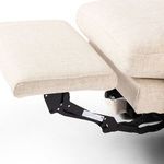 Extended footrest mechanism detail with smooth natural fabric and black metal hinge