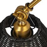 Close-up of brass socket housing and rattan structure from underneath the shade