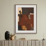 Side view of the abstract painting displayed above a console with styled decor in a beige wall setting