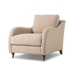 Lynne Chair angled view showing the curved rolled arm detail and side profile of cushions