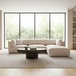 Matina Dream sectional styled in modern living room with large floor-to-ceiling windows, neutral rug, and low black coffee...
