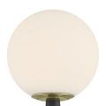 Close-up showing frosted glass globe with brass ring on textured gray body