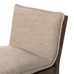 Close-up highlighting the fine stitching and upholstery details where cushion meets wooden edge of stool