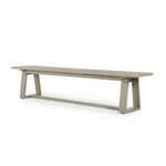 Angled side view emphasizing weathered grey teak finish and trapezoidal supports