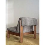 Rear three-quarter view of Pierce Accent Chair in room setting with beige walls and yellow carpet