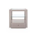 Front view emphasizing the centered knob on the drawer and open glass shelf above
