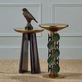 Room setting with two accent tables next to each other, one with black nickel base and gold top