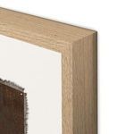 Close-up of the natural wood grain and beveled edges of the painting’s light wood frame