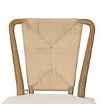 Close-up of the woven geometric pattern on the Greylin Dining Chair's backrest