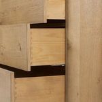Side detail of dovetail drawer joinery emphasizing craftsmanship
