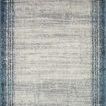 rectangular rug with muted blue border and light gray center featuring subtle distressed texture pattern