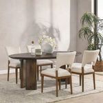 Norwood Mango Wood Dining Table styled in room with four beige padded chairs and natural light