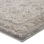 Duplicate close-up of the Odel rug corner showing textured polyester and polypropylene fibers with muted cream and gray tones