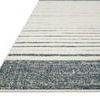 Close-up of Hagen White Ocean Rug corner showing flat weave border and textured pile stripes.