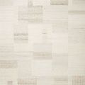 Manfred Ivory Pebble Rug with hand-knotted patchwork design in neutral ivory tones featuring varied high-low textures.