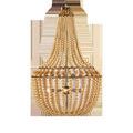 Penelope Beige Chandelier with antique brass finish, beige silken fabric beads, and golden nugget metal beads in empire shape
