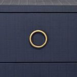 Close-up of brass ring pull and navy blue textured drawer front on Edelman Side Table
