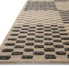 Close-up side angle showing alternating high-low pile texture and thickness of the rug
