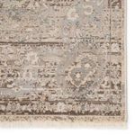 Detailed close-up of a border section highlighting the faded floral and geometric motifs