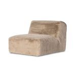 Profile view from left side showing compact design and plush upholstery contour