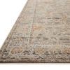 Close-up angled view showing the flat weave and detailed charcoal and apricot pattern