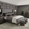 Urban bedroom scene with Linea dresser next to bed and coordinated nightstand, lamps, and rug