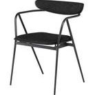 Three-quarter angled view showing open armrests and the contoured backrest of the Gianni Shell Dining Chair